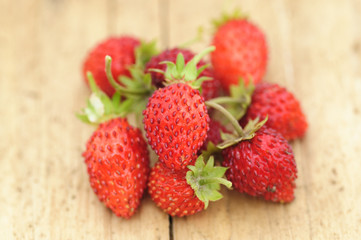 wild strawberries on a wooden table