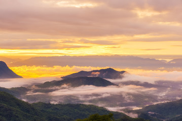 Fototapeta na wymiar The rising sun, sky cloud sunrise abstract with mountain, background and fog