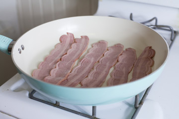 Raw Bacon in a Pan