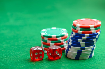 Casino green table with chips and dices