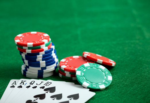 Casino green table with chips and play cards