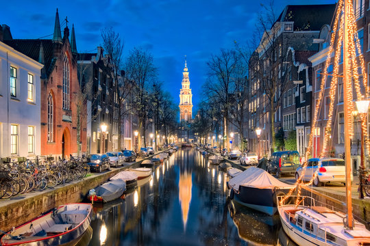 The canal in Amsterdam with Zuiderkerk church in Amsterdam city, Netherlands