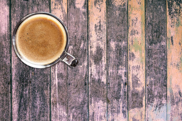 Top view of coffee cup on wooden table background