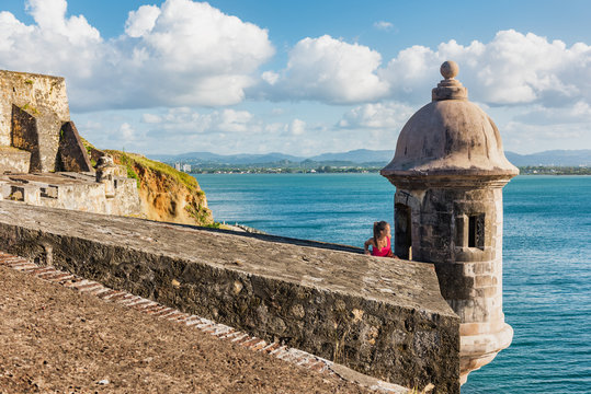 Puerto Rico travel people in Old San Juan, tourist woman visiting Castillo San Felipe del Morro Fortress, touristic attraction on cruise vacation destination. Summer holiday.