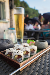 Sushi Set on the wood plate for outdoor restaurant dining in Rock Bar, Bali, Indonesia