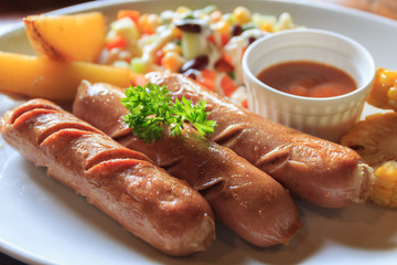 Breakfast sausage beef steak and salad.