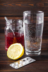 Drugs for colds - pills, spray. Folk remedies - lemon, tea, raspberry jam. Thermometer, handkerchiefs. Treatment of illness, influenza.