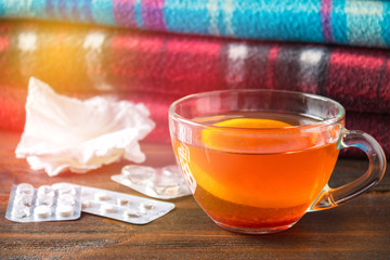 Drugs for colds - pills, spray. Folk remedies - lemon, tea, raspberry jam. Thermometer, handkerchiefs. Treatment of illness, influenza.
