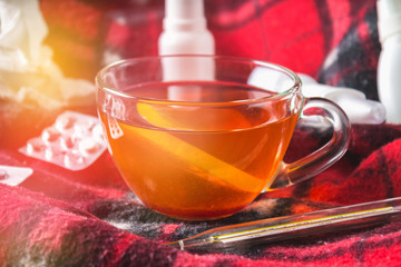 Drugs for colds - pills, spray. Folk remedies - lemon, tea, raspberry jam. Thermometer, handkerchiefs. Treatment of illness, influenza.