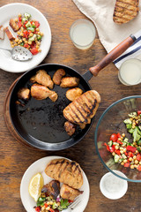 Fried meat, vegetable salad, toast, lemonade. Dinner table concept