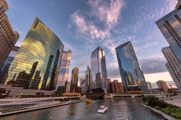 Chicago downtown and Chicago River with bridges during sunset.