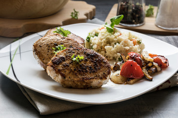 Pork medallions with grilled vegetables and vegetable couscous. Excellent food