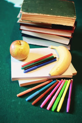 education concept books stack, apple and pen