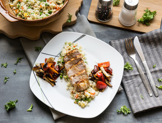 Pork medallions with grilled vegetables and vegetable couscous. Excellent food