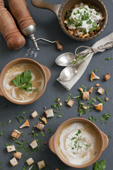 Cream soup from fresh mushrooms chanterelles with croutons. Background, top view, close-up