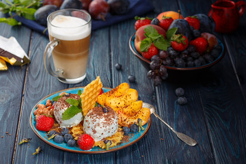 Homemade ice cream, coffee and fruits.