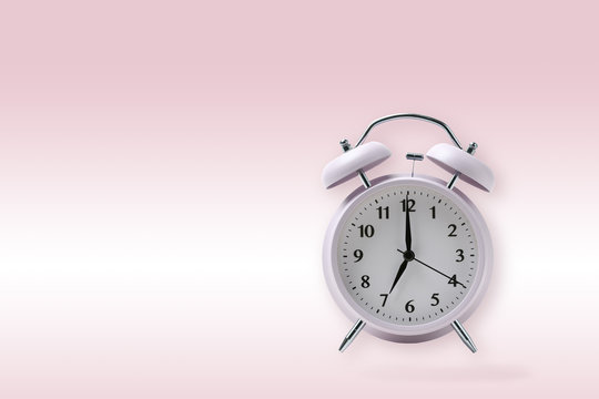 retro alarm clock on pink background, pastel alarm clock with clipping path