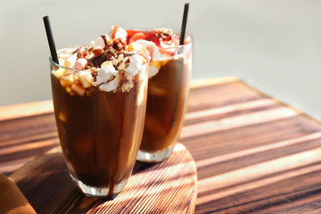 Dessert with cold brew coffee in glasses on table