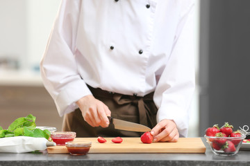 Female chef cooking in kitchen