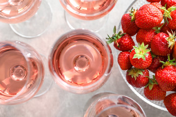 Fototapeta na wymiar Glasses of strawberry wine on table