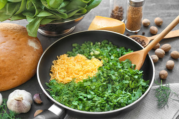 Ingredients for spinach sauce on frying pan