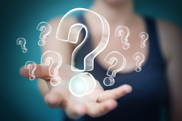 Businesswoman touching and holding hand drawn question marks