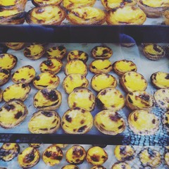 Pasteis de nata portuguese dessert display in Lisbon