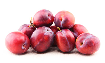 Composition with plums isolated on white background