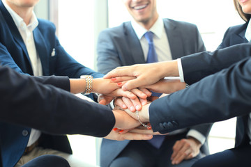 Group of businessman team touching hands together. Selective focus. - obrazy, fototapety, plakaty