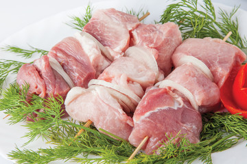 Raw pork beef meat on the white plate