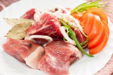 Raw pork beef meat on the white plate