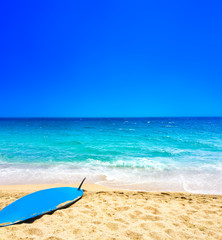 Beach, sea and surf background. Sandy beach, blue sky - Summer relax concept.