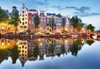 Schilderijen op glas Amsterdam bij nacht - Holland, Nederland. © TTstudio