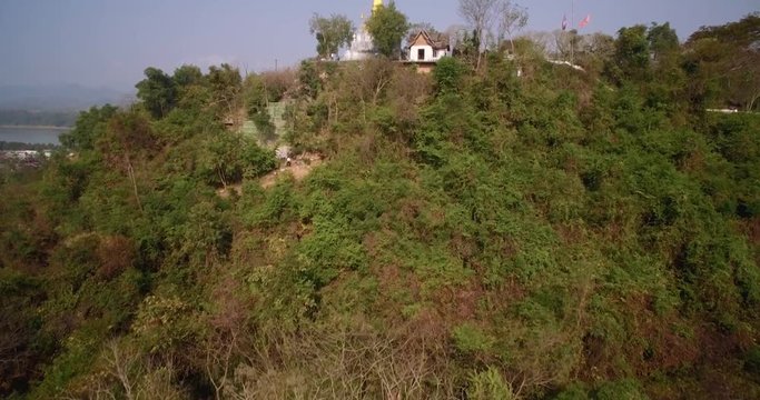 Aerial Drone Approach To Wat Chomsi Golden Stupa On Mount Phousi, Luang Prabang, Laos
