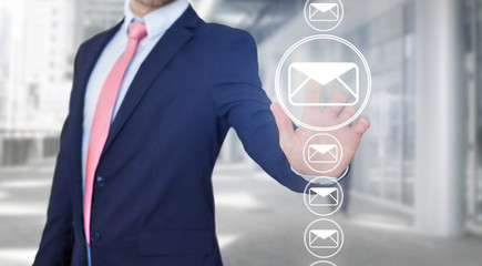Businessman touching technology interface with professional email  icon