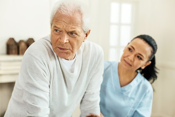 Cheerless elderly man feeling depressed