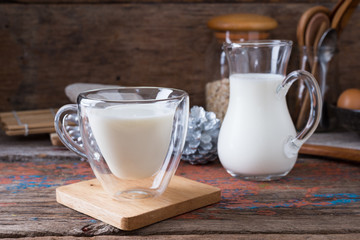 Milk cup on wooden on wooden background