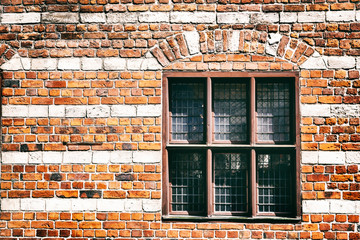 Facade of brick wall with window, beautiful background and texture