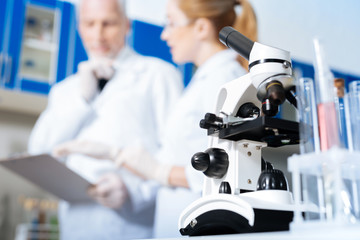 Close up of microscope that standing on the foreground