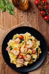 Traditional Italian fettuccini with salmon, shrimp and spinach.