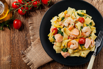 Traditional Italian fettuccini with salmon, shrimp and spinach.