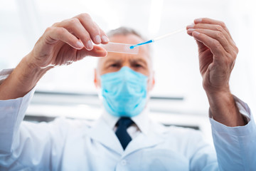 Handsome male person working at the laboratory