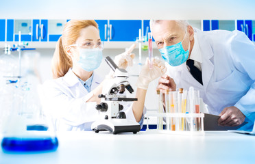 Fototapeta premium Competent blonde woman working in laboratory