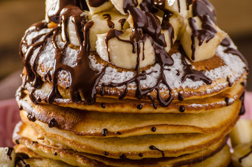 American pancakes with banana, chocolate