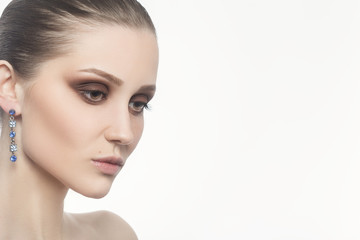 Fototapeta premium professional luxury female makeup on white background with copy space
