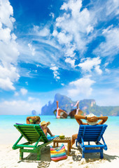 Couple on the beach at tropical resort Travel