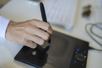 hand with digital tablet
