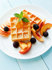 Belgium waffles with fruits and honey