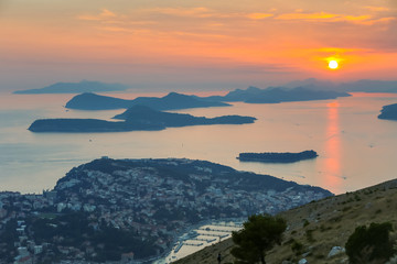 A view of Elafiti islands in the Adriatic sea next to Dubrovnik at sunset.
