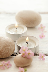 SPA still life with pebbles, flowers and aromatherapy candles